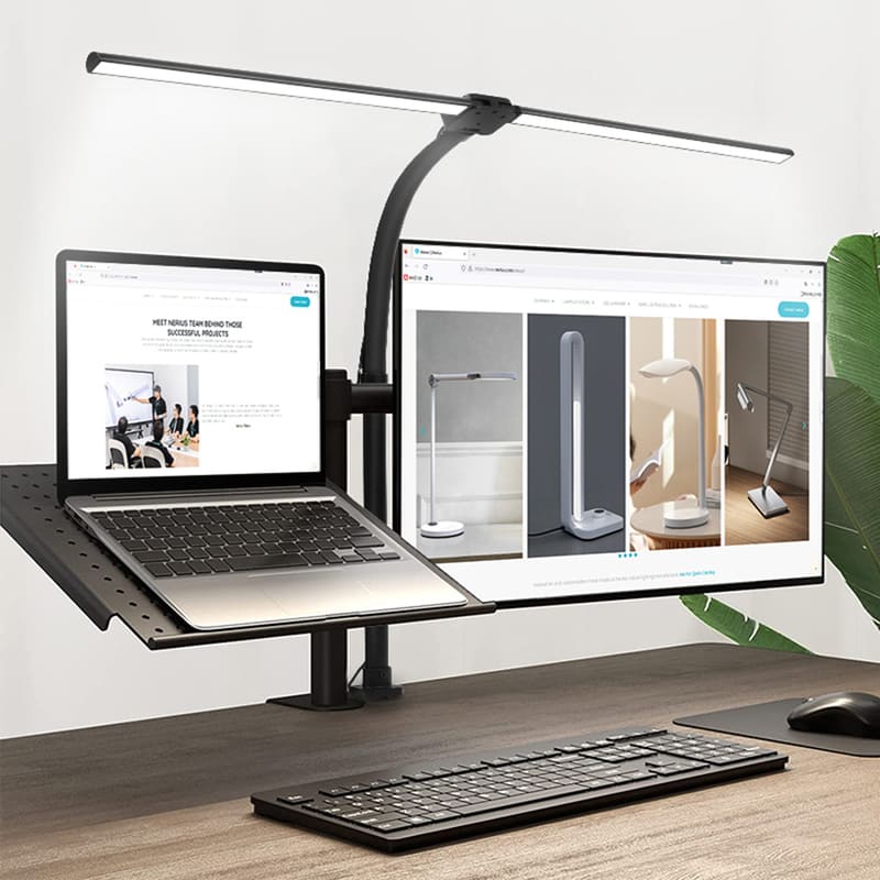 Mesa de trabalho com monitor e laptop